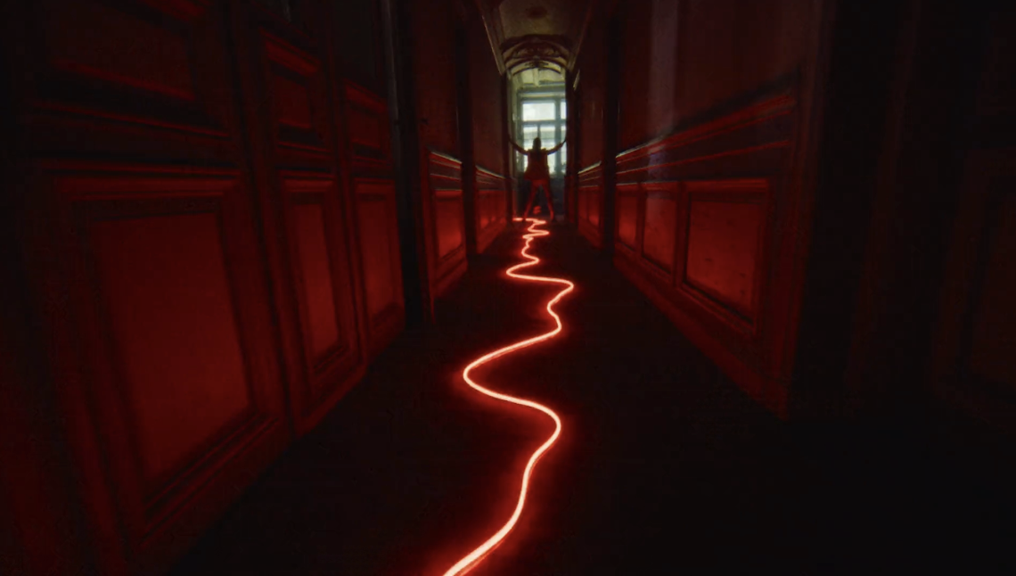 A red-lit hallway with a glowing trail leading to a distant figure